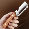 Stainless steel peeler with wooden handle for peeling and slicing fruits and vegetables | Durable and smooth operation