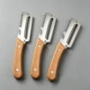Stainless steel peeler with wooden handle for peeling and slicing fruits and vegetables | Durable and smooth operation